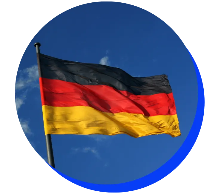 German flag fluttering in the wind against a clear blue sky. The flag has horizontal stripes of black, red, and gold.