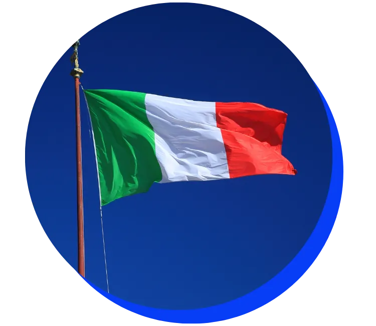 Italian flag waving against a clear blue sky. The flag features vertical stripes of green, white, and red.