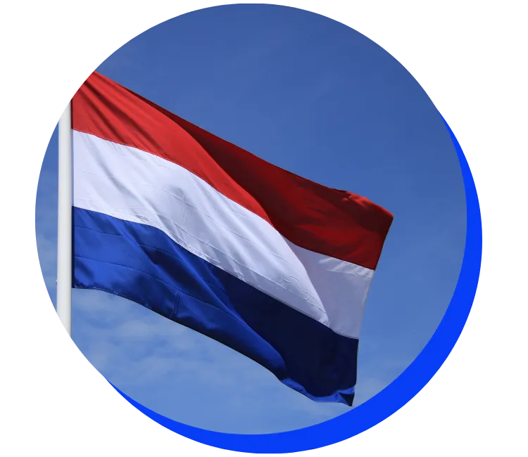 Dutch flag fluttering in the wind against a blue sky. The flag has horizontal stripes of red, white, and blue.